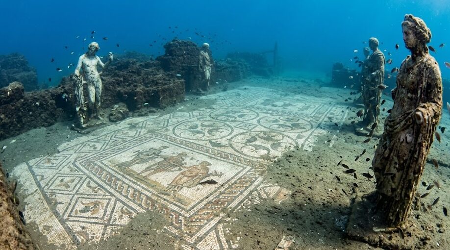 Well-preserved Roman mosaics and statues at the Baiae underwater archaeological park in Italy.