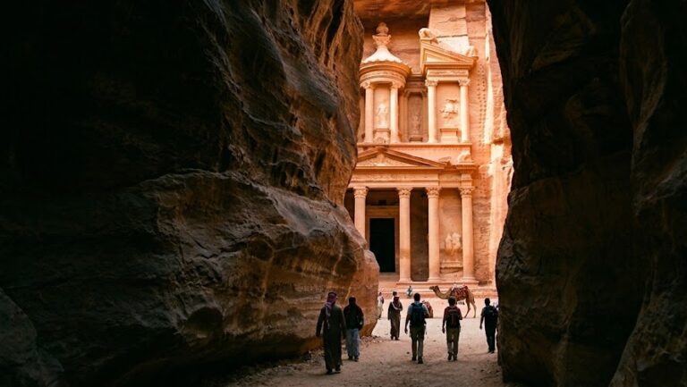 The magnificent Treasury revealed through the narrow gorge of the Siq on a Jordan Petra tour.