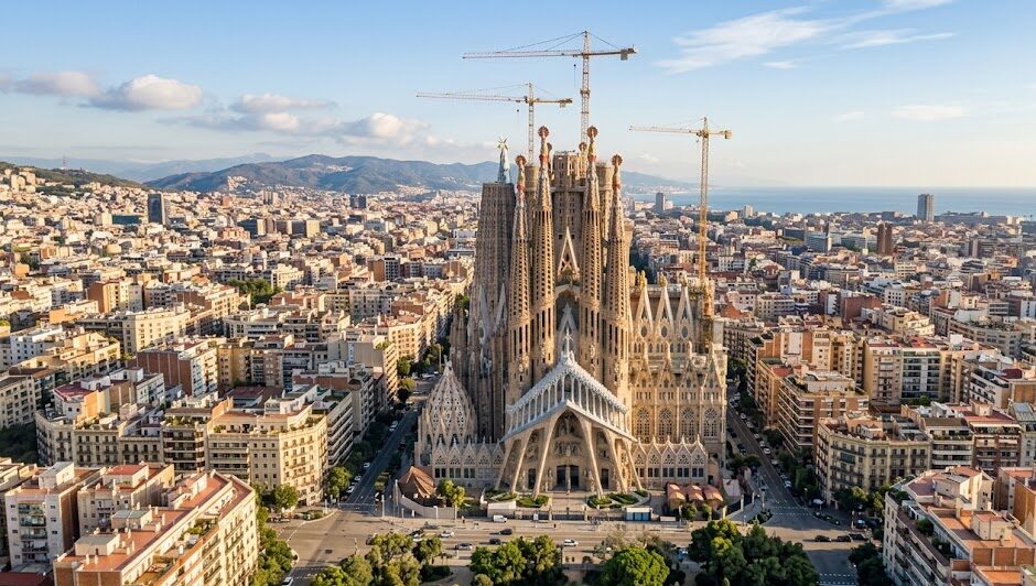 tourism places in spain: The iconic Sagrada Familia towering over the city of Barcelona in Spain.